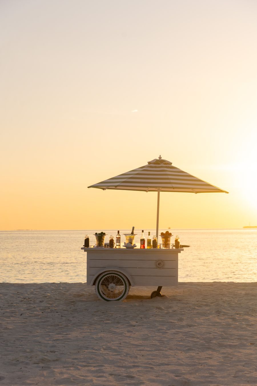 Cocktail stand on the beach at sunset